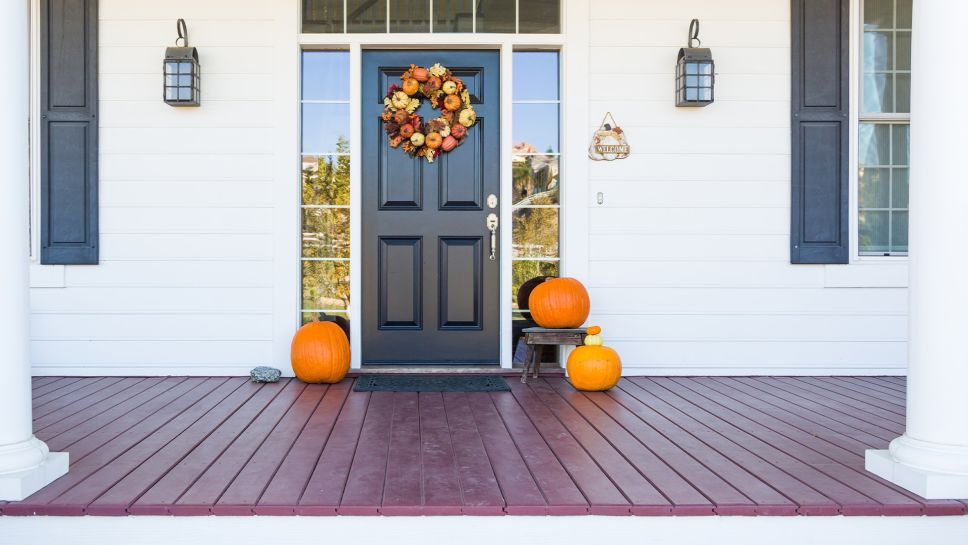 home's entryway decorted for autumn