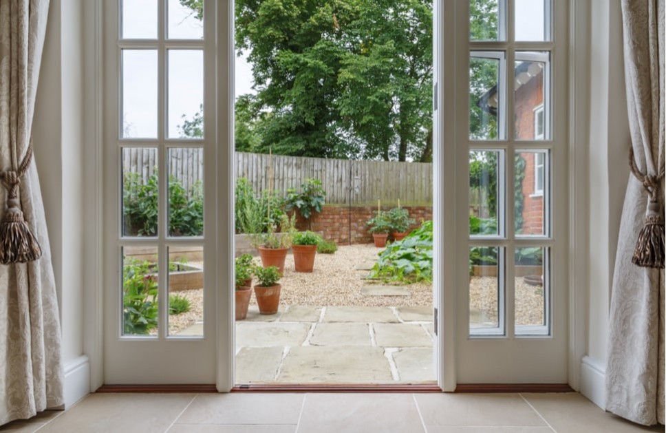 A patio door leading to a garden
