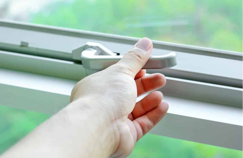 A person operating a window with a lift, one of many window parts