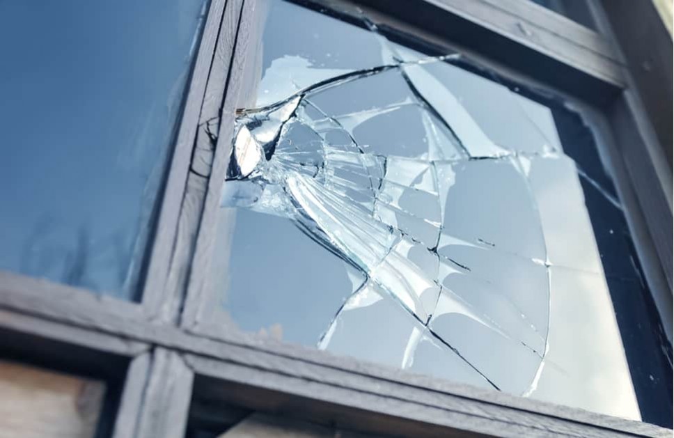A broken window that would require window repair or replacement
